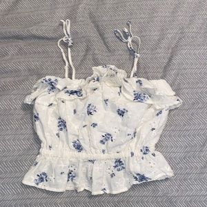 American Eagle white tank top with blue floral patterns